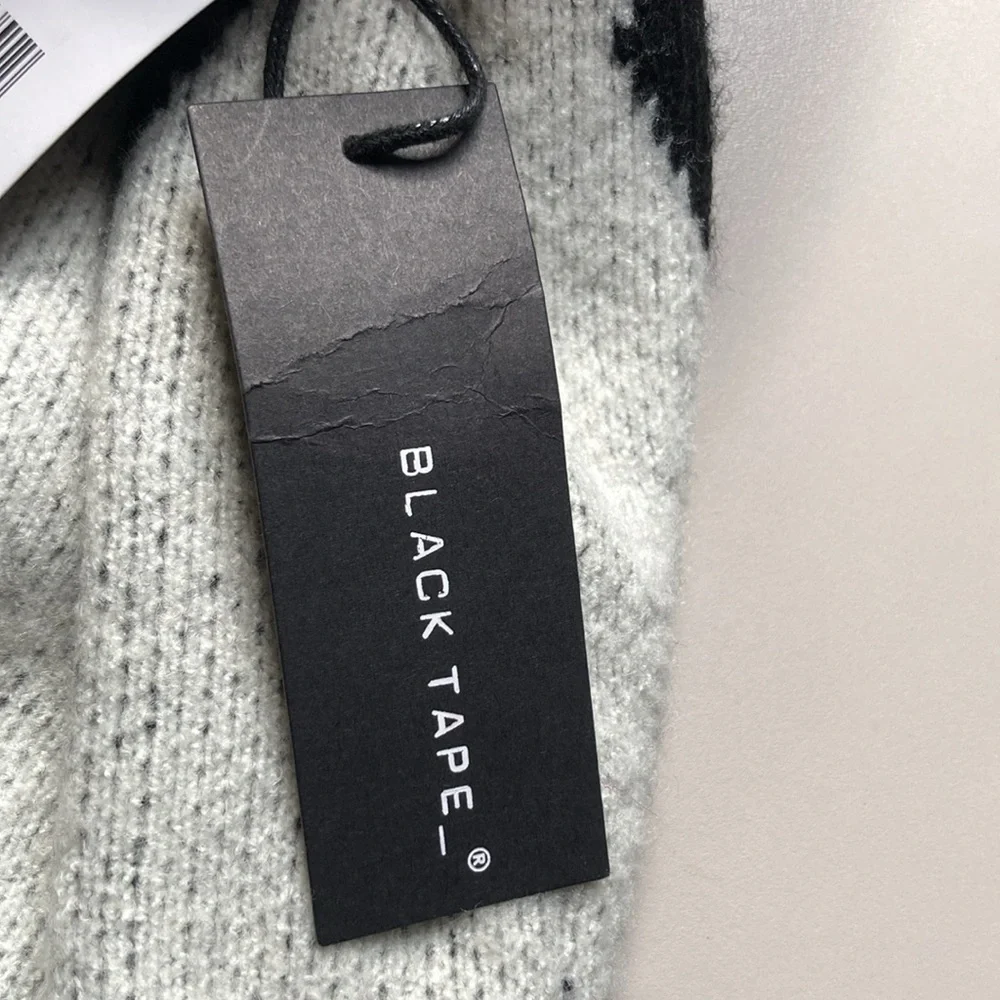 Black Tape NWT size small Black and white sweater. Excellent condition.